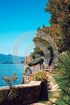Italian scenery of the walking path in the old historic villa on the shore of Lake Como.