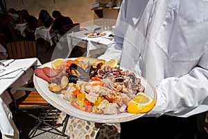 Italian seafood dish, served in a restaurant, italy