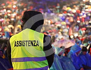 italian security guard during the event with text ASSISTENZA that means Assitance in Italian language photo