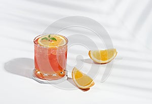 Italian soda strawberry orange on pastel color background. Exotic summer drinks