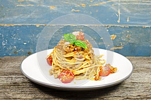 Italian spaghetti bolognese on wood background