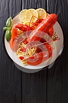 Italian spaghetti pasta with seafood lobster meat, tomatoes and