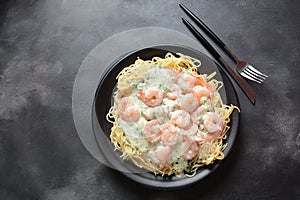 Italian Spaghetti or Pasta with shrimps, garlic and herbs  in a creamy Alfredo sauce.