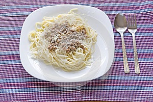 Italian spaghetti topped with bolognaise, or bolognese photo