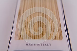 Italian spaghetti wrapped on a white table