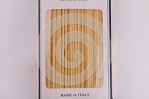 Italian spaghetti wrapped on a white table