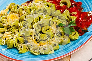 Italian spinach tortellini pasta with tomato sauce