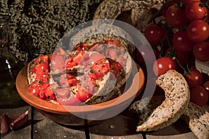 Italian starter friselle. Classical frisella with tomato, salt, oregano and olive oil. Dried bread called freselle. Tipical