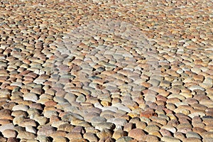 Italian street paved with ancient round stones