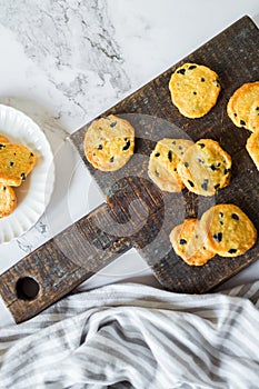 Italian style round shortbread cookies with black olives and Parmesan cheese