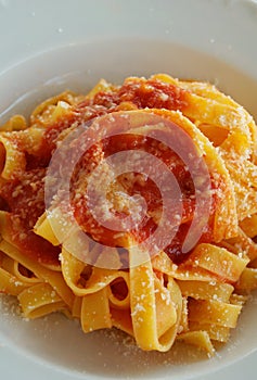 Italian tagliatelle with tomato sauce photo