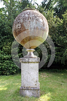 Italian terracotta jar on a column at Hever castle garden in England