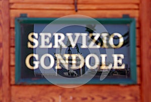 Italian text that means gondola service with the reflection in V