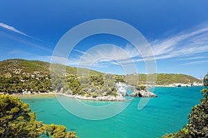 Italian touristic destination in Puglia - San Felice arch rock bay - Natural park Gargano with beautifulturquoise sea. Apulia,