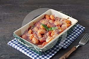 Italian traditional baked dish`Gnocchi al Pomodoro e Basilico`