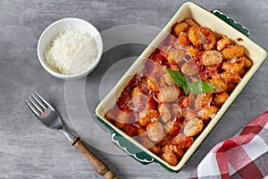 Italian traditional baked dish`Gnocchi al Pomodoro e Basilico`