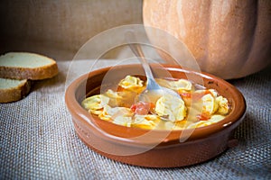 Italian traditional food called tortellini in brodo with bread photo