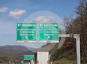 italian traffic signs with two roads Panoramica or Direttissima photo