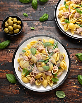 Italian Tuna conchiglie pasta with green beans, olives and red onion. Healthy diet food