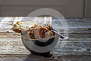 Italian vegetable soup with bread and spoon