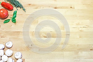 Italian vegetables and herbs on wooden table