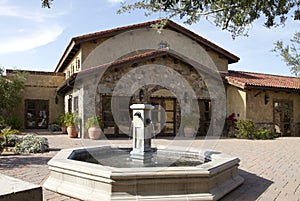 Italian villa and center plaza with fountain photo