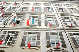 Italian windows with national flag in Turin