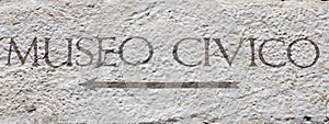 Italian writing museo civico - museum of the community- on a wall surface photo