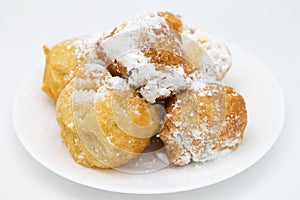 Italian Zeppole Donuts with Powdered Sugar on a White Plate