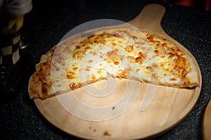 Italiana food. Pizza Serve on wooden plate photo