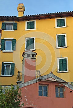 Colourful Ochre and terracotta Italianate houses with green shutters  photo