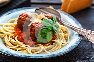 Itallian spaghetti and meatballs and parmegano for dinner, comfort food, close view