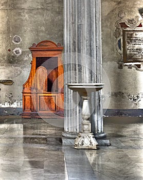Italy. Baptismal font and confessional of the Catholic Church in the city of Rome. HDR image