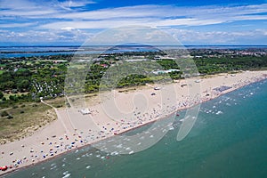 Italy, the beach of the Adriatic sea. Rest on the sea near Venice. Aerial FPV drone photography.