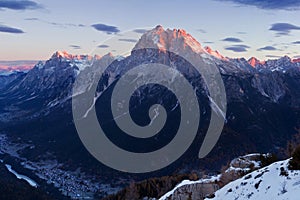 Italy, Dolomites, Alps - wonderful scenery, above the clouds at beautiful day in winter with first snow, Italy. Monte Antelao