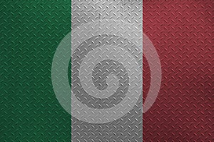 Italy flag depicted in paint colors on old brushed metal plate or wall closeup. Textured banner on rough background