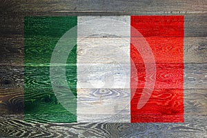 Italy flag on rustic old wood surface background