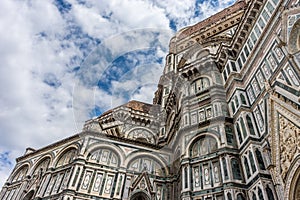 Italy,Florence, Florence Cathedral, a large stone building with a clock tower with Florence Cathedral in the background
