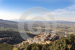 Italy Grosseto Maremma, route in MTB and EMTB in the woods of Gavorrano up to Mount Calvo, panoramic view of the village and the photo