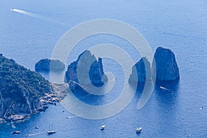 Italy. Island Capri. Faraglioni rocks and boats from Monte Solaro