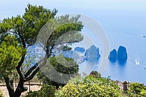 Italy. Island Capri. Faraglioni rocks and boats from Monte Solaro