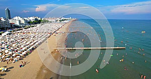 Italy, Jesolo. Lido di Jesolo, or Jesolo Lido, Europe beach Venice, Aerial forward dolly, footage in HDR, HFR