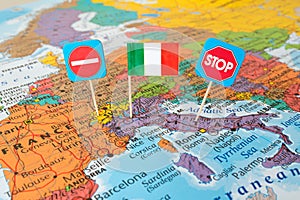 Italy lockdown concept image stop Corona virus country flag and stop signs on map, travel restrictions border shutdown