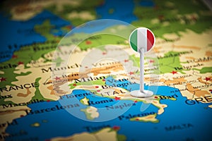 Italy marked with a flag on the map