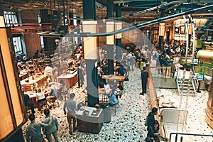 Italy, Milan, May 30, 2019: People, tourists and coffee lovers at Starbucks Reserve in Milan. The interior of the coffee