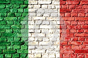 Italy national flag painted on a brick wall with the traditional green, white and red colors.