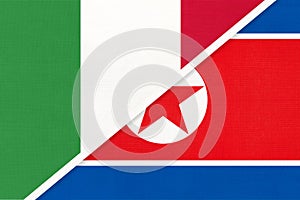 Italy and North Korea or DPRK, symbol of two national flags from textile. Championship between two countries