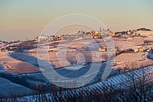 Italy Piedmont: Barolo wine yards unique landscape winter sunset, Grinzane Cavour medieval village castle on hill top, italian