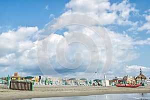 Italy, Rome, Ostia, Tyrrhenian Sea. Beginning / end of the beach season. The coastline is lined with folded umbrellas and sun beds