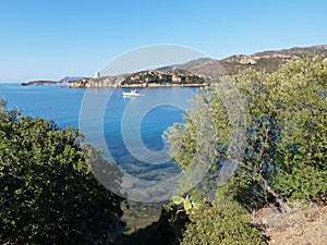 Italy, Sardinia, Porto Budello, Teulada, view of the bay, in the background the medi vegetation, in the background rocky mountains